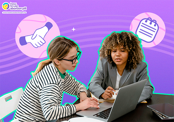 Two healthcare providers discussing post-abortion follow-up care at a laptop
